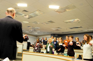 Members of the DFM community do some breathing exercises in between sharing big ideas at the recent Blue Sky event on March 18, 2015