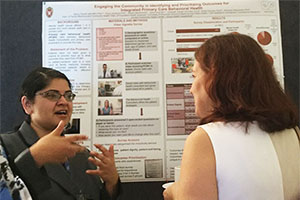 Nancy Pandhi, MD, MPH, PhD, discusses her team’s research at NAPCRG’s poster walk.