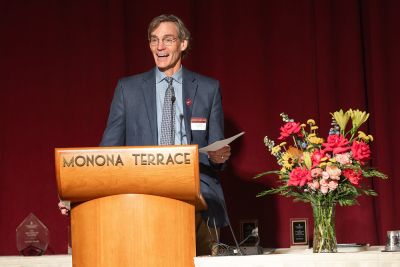 Dr. Dave Rakel at podium.