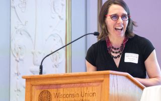 Dr. Kjersti Knox at a podium.